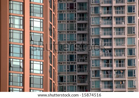 Modern residential buildings in China. Closeup photos of wall, windows, balcony.