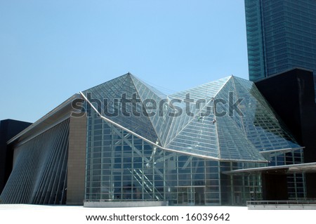 China, Guangdong province, Shenzhen city. Modern library with special design, fully covered with glass panels, inside steel irregular construction.