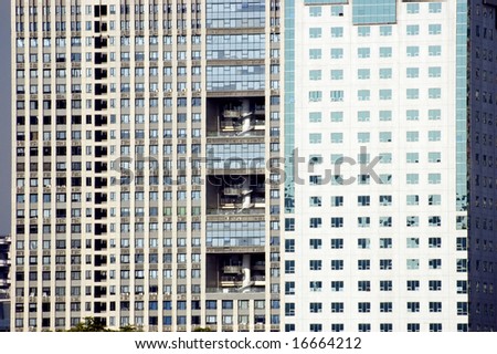 China, Shanghai - closeup photo of modern buildings with visable windows and balconies.