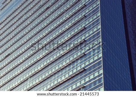 Closeup photo of modern skyscraper. Walls and window\'s panels. Skyscraper in Shenzhen city, China.