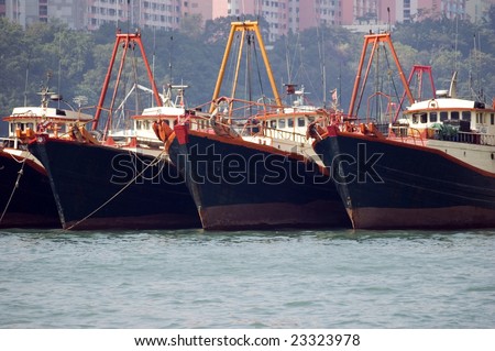 Medium size vessels waiting in Hongkong, Aberdeen harbour. Ships holding for departure.