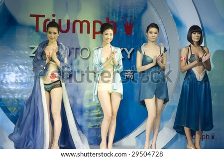 SHENZHEN, GUANGDONG - MAY 1: Models parade famous brand underwear at a fashion show May 1, 2009 in Shenzhen, Guangdong, China.
