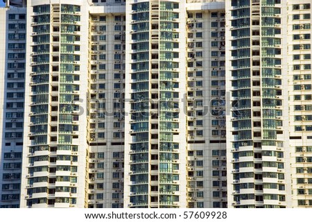 Residential buildings in China. Close up photo showing hundreds of apartments, windows and balconies.