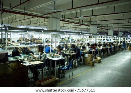 SHENZHEN, CHINA - MARCH 11: GO-ON earphone factory produces wireless earphones - 2,4GHz and RF/UHF system which works even 100 meters away from transmitter. Assembly line on March 11, 2011 in Shenzhen, China.