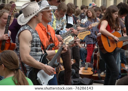 WROCLAW, POLAND - APRIL 30: Guitars World Guinness Record, 5601 participants gather in front of Wroclaw's Town Hall on April 30, 2011 to beat guitar mass participation record in Wroclaw, Poland.