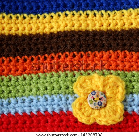 part of colorful knitted wool with knitted flower