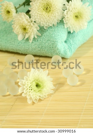 Spa composition. Towel, flowers and decorative balls