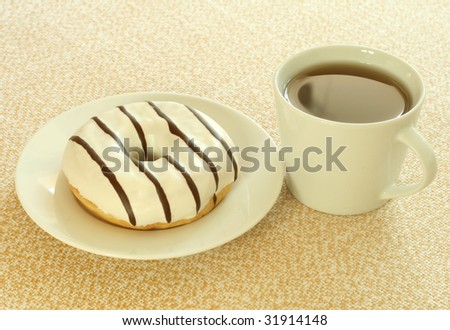 Donut and cup of tea. Breakfast.