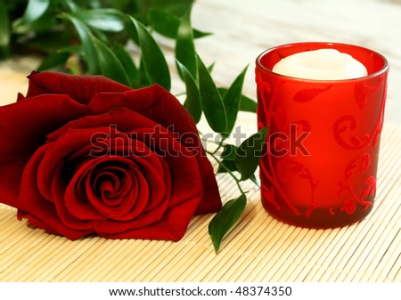 red rose and red candle