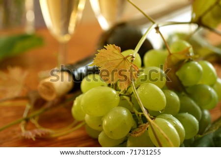 fresh grapes, vine and vine bottle, holiday background