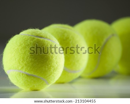 tennis balls in the row ,for tennis,recreation and sport themes