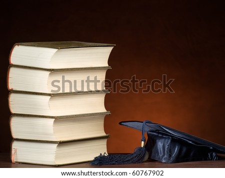 Stack of books and graduation cap, for various education,graduation or knowledge themes