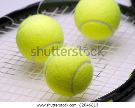 tennis balls on the  racket ,for tennis,recreation and sport themes