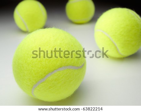tennis balls on white surface ,for various tennis,recreation and sport themes