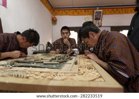 Students learning traditional wood work process at school of arts and crafts, Thimpu, BHUTAN, Circa MAY 2015
