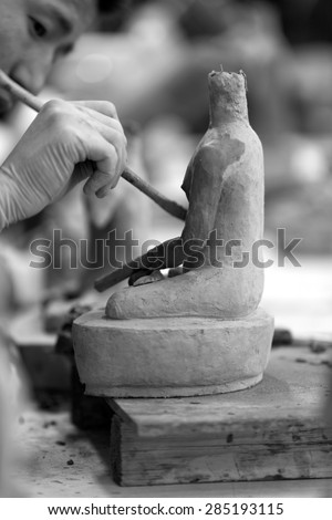 THIMPU, BHUTAN - CIRCA MAY 2015: Student learning to create sculpture at arts and crafts school.