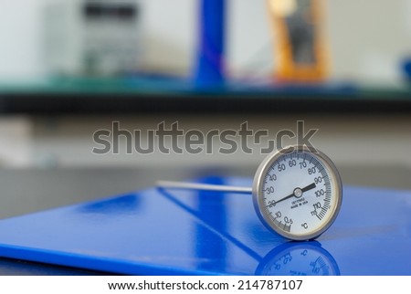 Close shot of thermometer in electrical laboratory.
