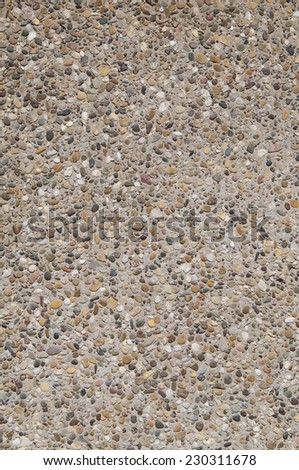 Textured background of exposed aggregate concrete