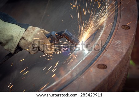 Sparks during cutting of metal manual plasma cutting machine