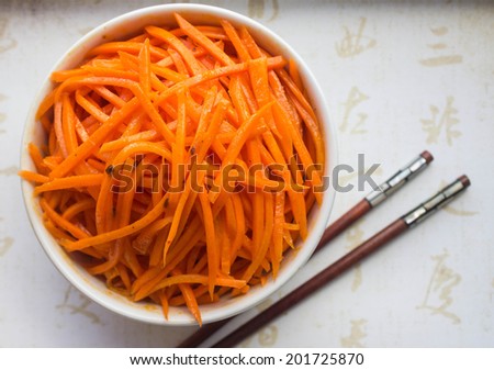 Korean carrot salad in a white plate