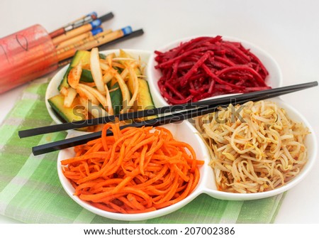 vegetable salad with fresh vegetables - carrots, beets, cucumber and soy sprouts