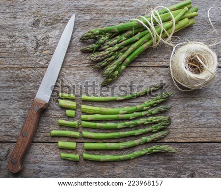 ripe green asparagus on a wooden background