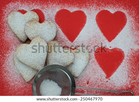 Heart shaped cookies with sugar powder for valentine\'s day. Shallow depth of field