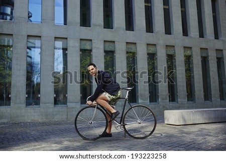 Man ready to ride his awesome black and metal fixed gear bike