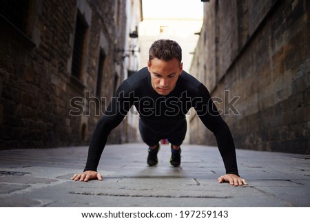 Muscular beautiful is pushed from the floor before morning jog
