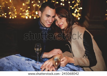 Lovely young couple having romantic dinner in restaurant, beautiful couple in love enjoying and spending time together
