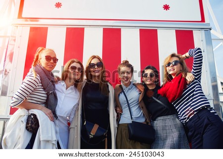 Portrait of beautiful group of women having fun at sunny day during their holidays vacation
