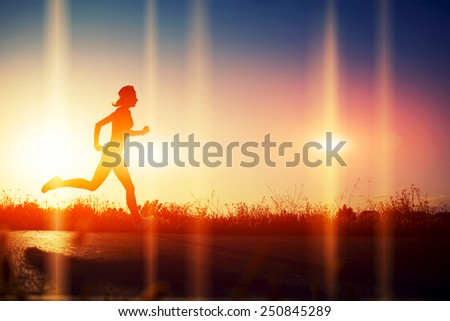 Silhouette of athletic woman running down the beautiful road at sunset, image with flares indicate the direction of run, heartbeat and running woman, cardiac Frequency, heart rhythm