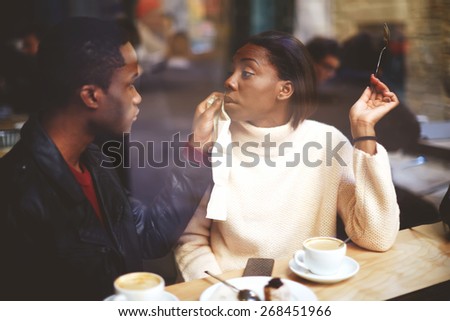 Beautiful couple having lunch, two people in cafe enjoying the time spending with each other, happy friends having coffee together, having a great time together, view through cafe window, best friends