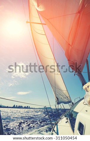 Luxury yacht sailing in open sea against calm sea and blue sky background with copy space area for your text message or information content, amazing journey on modern boat in sunny summer day