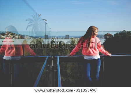 Half length portrait of stylish hipster girl posing outdoors with copy space area for your advertise text message, attractive female dressed in trendy basic clothes looking away, filtered image