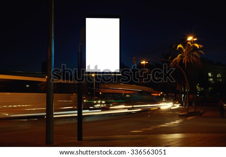 Electronic advertising board with empty screen copy space for your text message or promotion content, clear banner on the city at night, empty poster outdoors, public information billboard on roadway