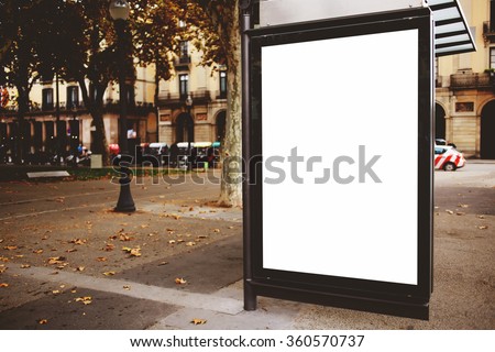 Blank billboard with copy space for your text message or promotional content, public information board on the street, advertising mock up empty banner in metropolitan city, clear poster on a bus stop