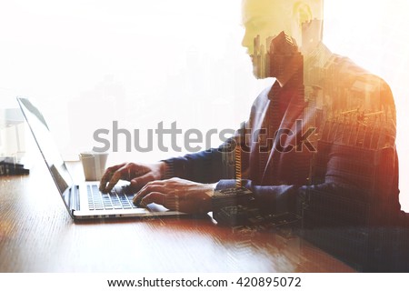 Double exposure of man trader dressed in corporate suit is analyzing financial market via laptop computer. Skilled businessman keyboarding e-mail letter while using net-book. High technology concept