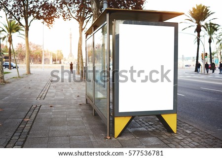 Blank electronic advertising board with empty copy space screen for your text message or promotional content, clear banner in urban setting, empty poster on a bus stop, public information billboard