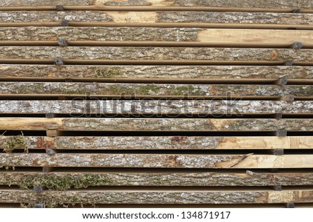 Lumber. Stacked lumber 2 in times 12 in drying with perpendicular \