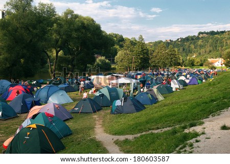 CESKY KRUMLOV, CZECH REPUBLIC - AUGUST 1, 2008: camping site Nove Spoli during weekend, when many tourist gather to make a raft descend along Vltava river. Old Krumlov is a UNESCO World Heritage Site