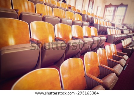 several rows of chairs in a conference room (texas congress senate room); several filters, artificial white balance and tilt shift applied