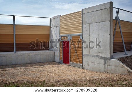 emergency and maintenance door in the highway traffic noise barrier fence