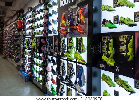 LJUBLJANA, SLOVENIA - SEPTEMBER 18, 2015: Photo shows a soccer shoes display wall at the SPORT 2000 store. In the picture are mainly shown the Adidas, Puma and Nike examples.