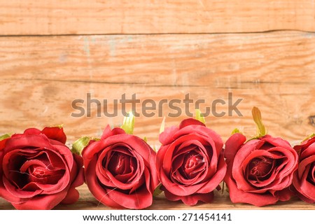 Romantic red roses flowers on a vintage wooden planks background, mothers day card, wedding invitation, greetings card, and invitation cards