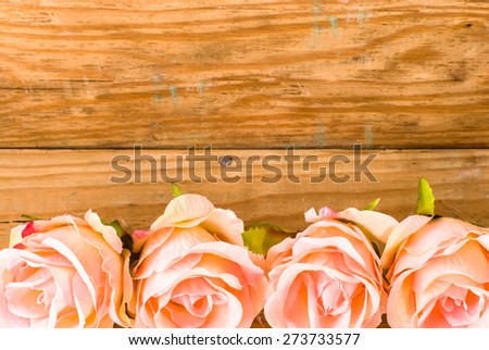Pink roses flowers on a vintage wooden planks background for mothers day, wedding invitation, greetings card and invitation card, flowers backgrounds