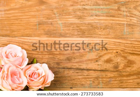 Pink roses on a vintage wooden planks background for mothers day, wedding invitation, greetings card and invitation card, flowers backgrounds