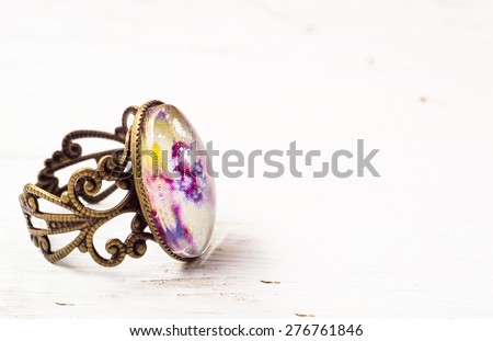 Vintage jewelry ring isolated on wood background
