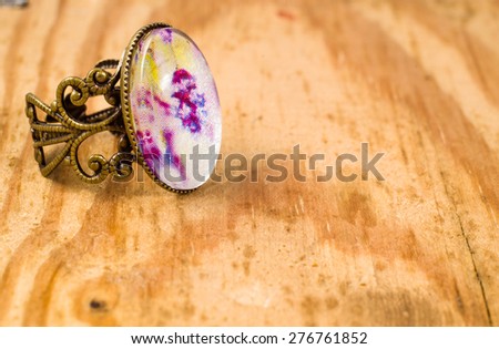 Vintage jewelry ring isolated on wood background