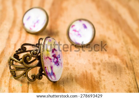 Vintage jewelry set isolated on wood background